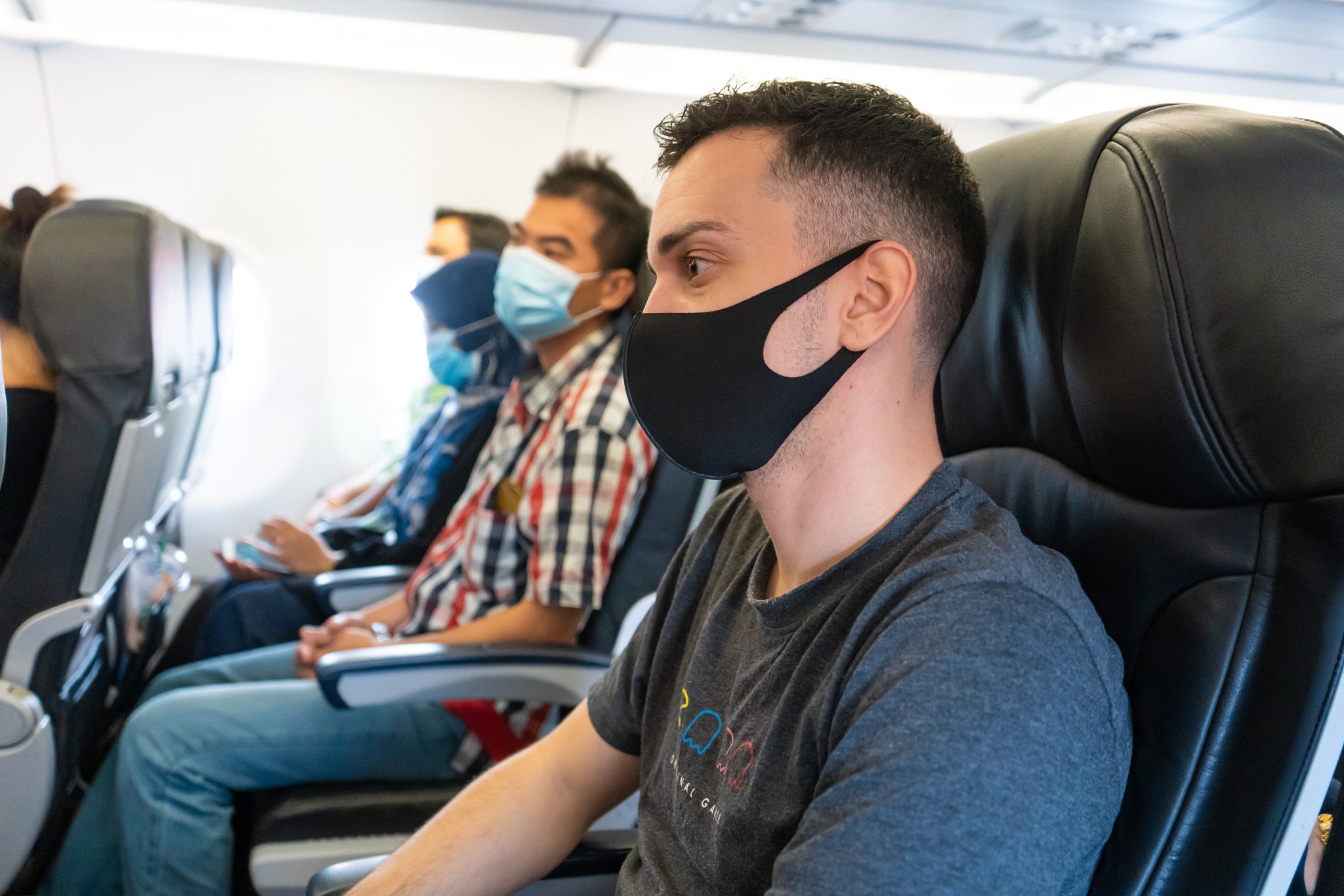 Airplane Passengers Are Wearing Medical Masks On Their Faces. Ai